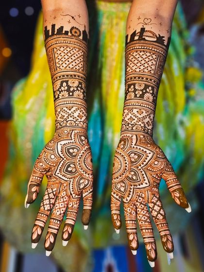 A clear shot of the symmetrical skyline design on both arms, a perfect way to personalize your bridal look.