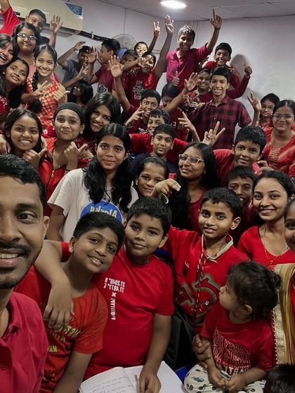 A joyful selfie capturing the vibrant red outfits and happy smiles of our students and teachers.