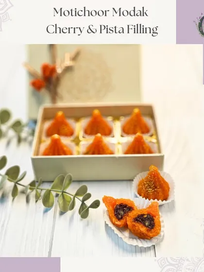 A box of our Motichoor Modaks with a delicious cherry and pista filling. A modern twist on a traditional favorite for Ganesh Chaturthi.
