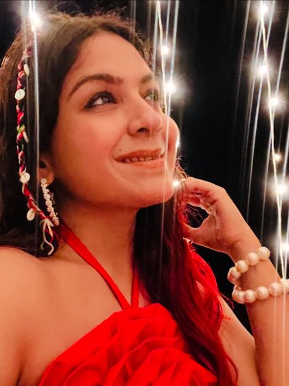 A close-up shot showing my beach party accessories. The shell headband, pearl bracelet, and glowing lights create a magical, festive look.