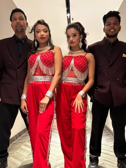 Here is a part of my talented team, ready to bring the energy to an event. Dressed in coordinated red and black outfits, we believe in looking as professional and sharp as our dance moves.
