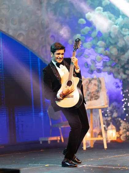 A groom's fun-filled performance with a guitar prop. We love incorporating creative elements to make your dance unique.
