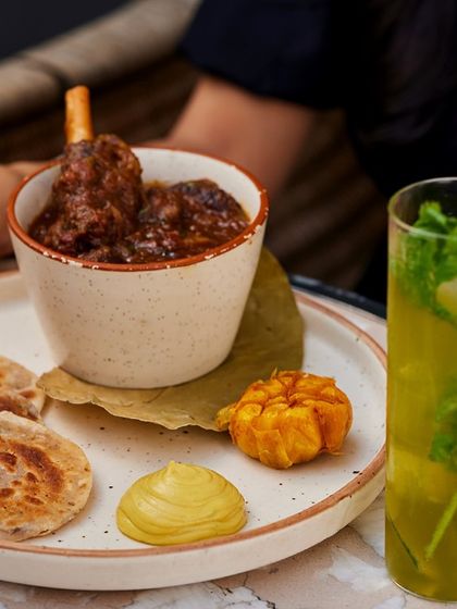 Another example of our delivery-ready meals. This Champaran meat dish, paired with parathas, is perfect for a special meal at home, bringing our restaurant experience to your doorstep.