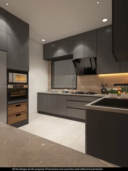 A view showing the built-in microwave and oven, as well as the large refrigerator, all seamlessly integrated into the cabinetry.