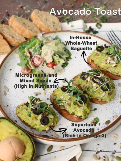 Our Avocado Toast is a beautiful dish served on an in-house whole-wheat baguette. It's topped with tangy guacamole rich in Omega-3 and garnished with nutrient-rich seeds and microgreens.