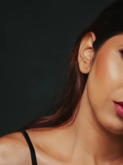 A tightly cropped abstract beauty shot, focusing on the texture of the skin, the curve of the lip, and the smooth contouring.