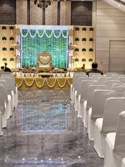A view from the audience of a grand baby shower stage setup. This shows how I plan the entire hall layout, including guest seating, to ensure everyone has a great view of the main ceremony.