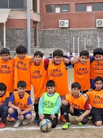 The team lined up before a friendly match against Sanskriti School. These matches are crucial for testing our tactics and giving every player valuable game-time experience on a natural grass field.