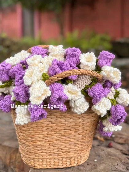This is our viral blanket bouquet, made from 100% cotton yarn. It's a beautiful bouquet of crochet flowers that unfolds into a soft baby blanket.