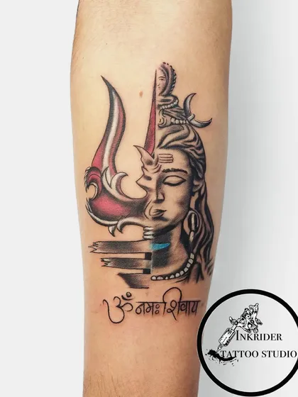 We specialize in transformative cover-ups, like this powerful Mahadev piece. We worked with the client to completely hide an old tattoo with a design that represents strength and divinity, combining detailed portrait work with the iconic Trishul and Om Namah Shivay script.