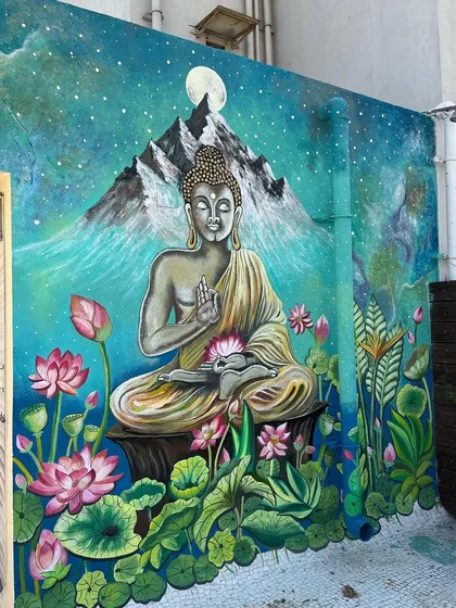 A full view of the 12.5x10 feet Buddha mural, transforming the terrace wall.