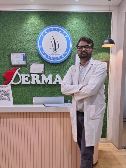 A picture of one of our consultant dermatologists at the clinic reception, ready to welcome you to your hair restoration journey.