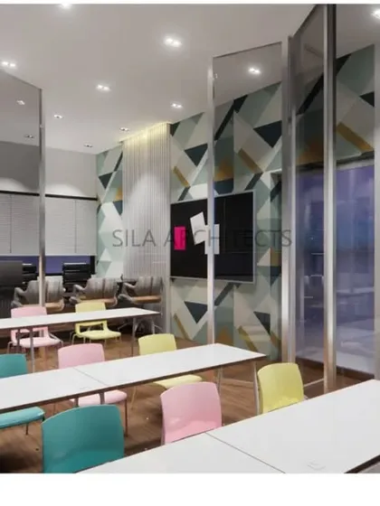 The classroom design for SIP Abacus, featuring flexible seating, ample writing surfaces, and glass partitions that can be moved to create different learning configurations.