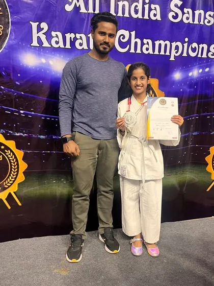 Another one of our dedicated students with her medal and certificate at the All India Sanshinkan Karate Championship. Her achievement is a testament to her hard work.