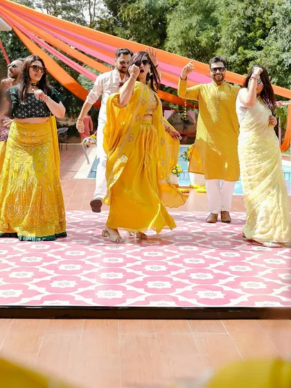 A poolside Haldi calls for a dance party! We set up a dedicated dance floor and colorful decor to get everyone moving and celebrating with the happy couple.
