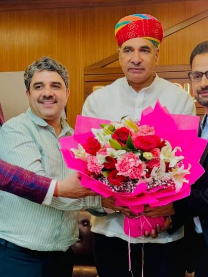 Welcoming a distinguished guest with a bouquet at a Bar Council of Delhi event for new law graduates.