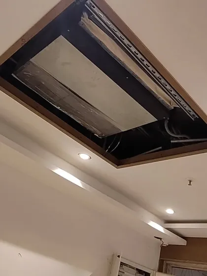 A close-up of the ceiling during construction, showing the installation of a concealed air conditioning unit. Integrating technical systems like HVAC seamlessly into the design is a crucial part of my process.
