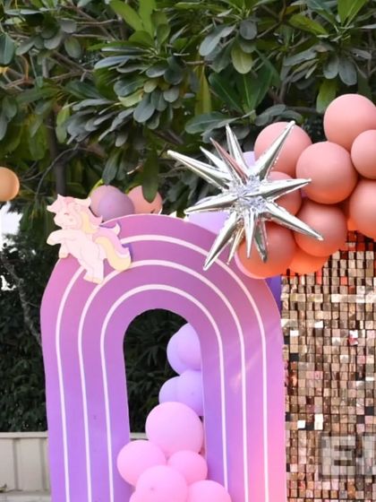 A close-up of the rainbow arch and star-shaped balloons from the unicorn party. I believe the details are what make a party truly special.