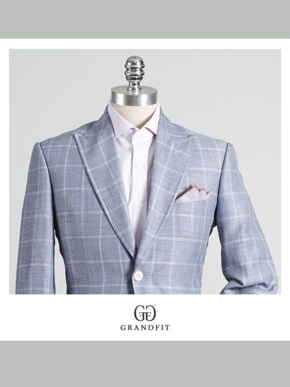 A close-up of the light blue check suit, showing the crispness of the pattern and the subtle texture of the fabric.