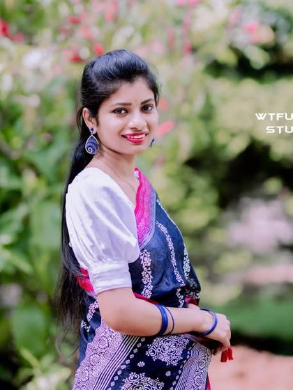 A beautiful solo portrait of a bride-to-be in a traditional saree.