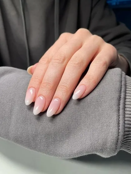 A beautiful example of a natural-looking ombré on almond-shaped nails, perfect for an everyday elegant look.