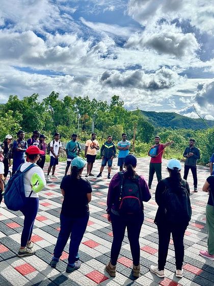 The trek leader giving a briefing to the group before starting the Netravathi peak trek.