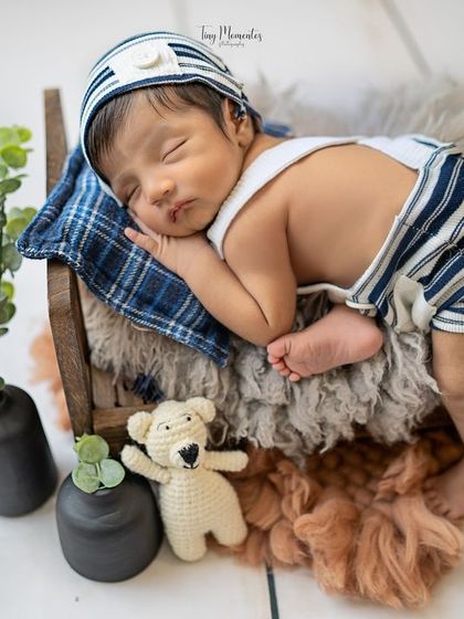This setup with a miniature bed, teddy bear, and greenery creates a complete little scene. It’s a wonderful way to capture the magic of your baby's dream world.