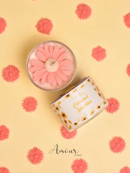 The pretty pink sunflower candle, scented with rose fragrance. It's a beautiful and cheerful addition to any space.