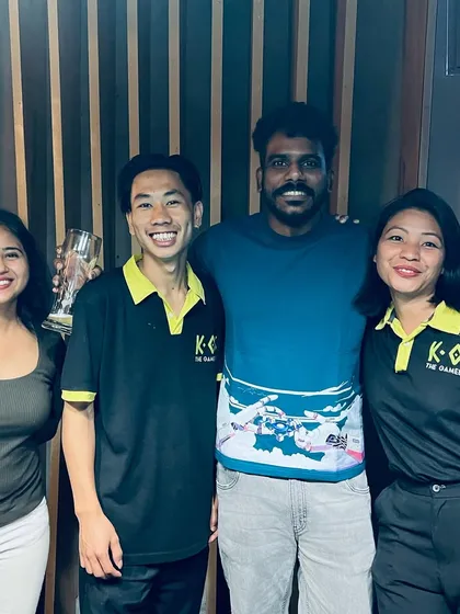 Our amazing staff posing with a happy guest. We're a family here, and we love seeing our community grow every week.