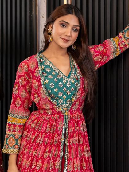 The full view of our pink and green printed jacket set. This outfit is perfect for a mehendi or sangeet, offering a comfortable yet incredibly stylish look.