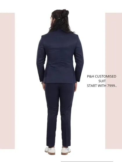 The back view of the navy blue suit, showcasing its traditional and impeccable tailoring.