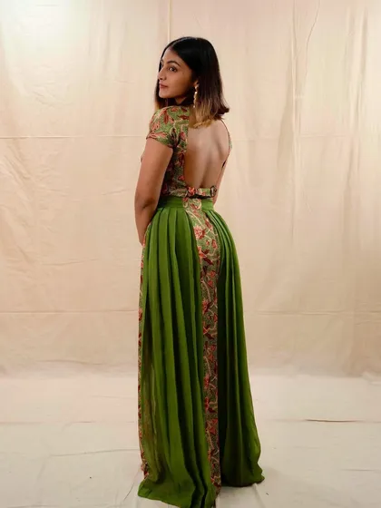 Another shot of this unique festive outfit. The combination of the flowing green skirt and the fitted, embroidered top creates a beautiful and flattering shape.