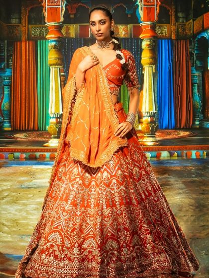 This image showcases how back projection can bring vibrant, traditional settings to life. We used a colorful palace backdrop and lit the model with Profoto and Aputure gear to make the handcrafted lehenga's details pop.