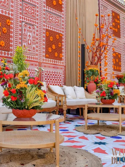 A comfortable lounge area set against a wall featuring traditional Indian block print patterns and jali work. The goal was to provide a beautiful space for guests to relax and soak in the atmosphere.