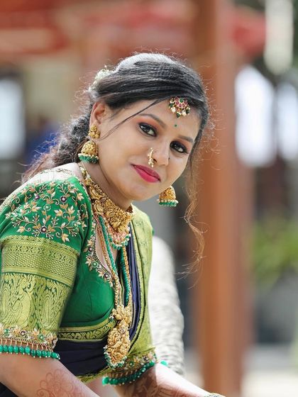 A lovely close-up of Dikshitha. The temple choker and matching jhumkas perfectly frame her face.