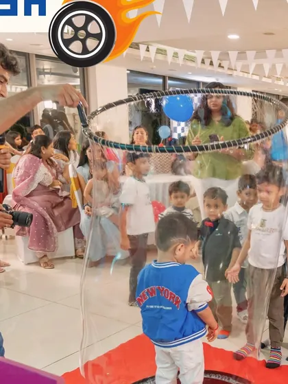 A giant bubble show captivating the young guests. We incorporate magical entertainment like this to create moments of wonder and excitement for the children.