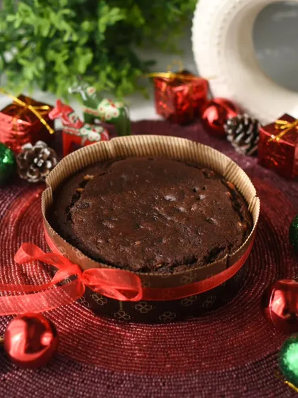 My traditional Christmas Plum Cake, a true old-fashioned delight. It's loaded with assorted fruits and nuts soaked in rum or orange juice, bringing the classic warmth and spice of the holiday season to your table.