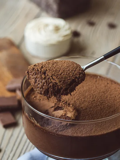 A spoonful of my decadent dark chocolate mousse, showing its light, airy texture and rich cocoa finish. It's pure indulgence.