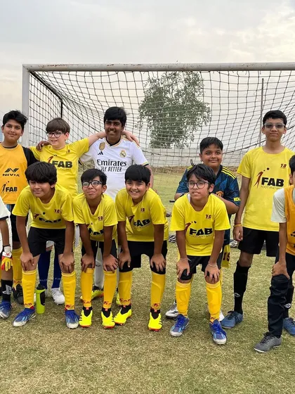 A team photo before a friendly match. These matches provide invaluable exposure and help refine teamwork.
