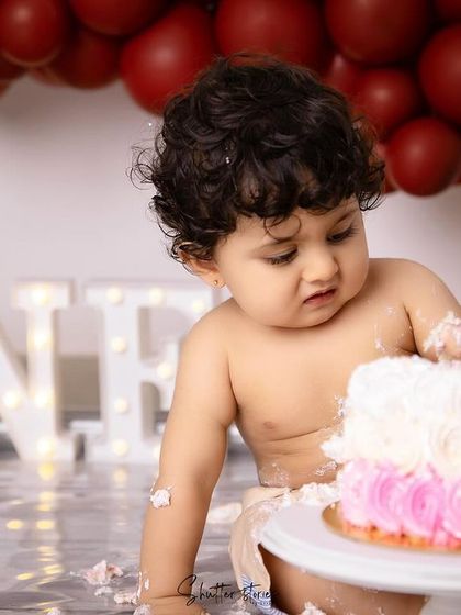 Another angle of the messy fun, with the "ONE" sign in the background.