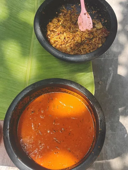 A preview of my Vishu Sadya, served in traditional earthen pots. You can see the vibrant Pumpkin Pulinkari and the textured Jackfruit Thoran, ready to be served on a fresh banana leaf.