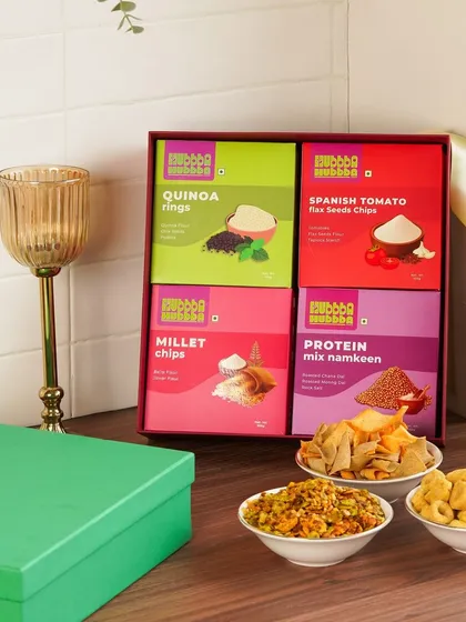 Another angle of the festive snack box, showing the colorful packaging and the delicious snacks ready to be enjoyed.