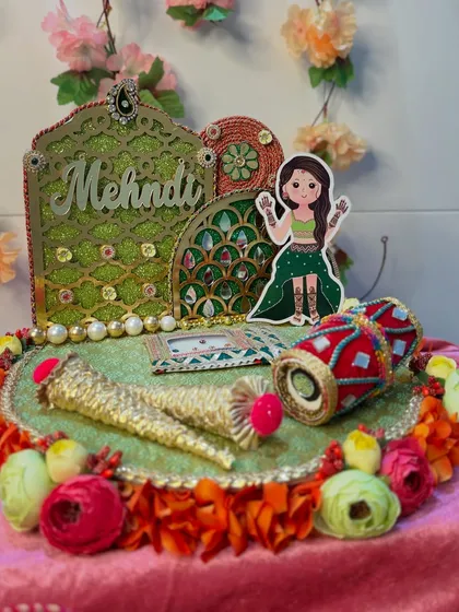 The complete Mehendi platter, ready for the ceremony. The combination of traditional elements and playful details creates a festive and joyful vibe that is perfect for the occasion.