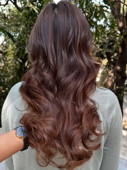 This is my 'Chocolate Pecan Dream' creation. We started with a faded base and gave her this incredibly rich, warm brown with delicate pecan highlights. The result is a glossy, healthy-looking color that’s perfect for any season.