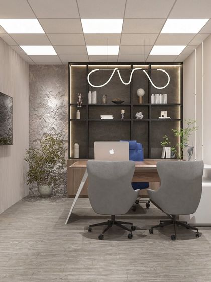 This minimalist office cabin for a factory owner in Neemrana features a textured stone wall, sleek shelving, and a unique pendant light, creating a luxe and modern feel.