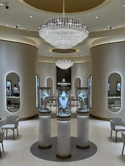 The Hazoorilal Legacy store in Dubai is an exercise in understated luxury. We used a soft, neutral palette of warm whites and subtle gold accents to create a calm, inviting backdrop that allows the fine jewellery to be the undisputed focus.