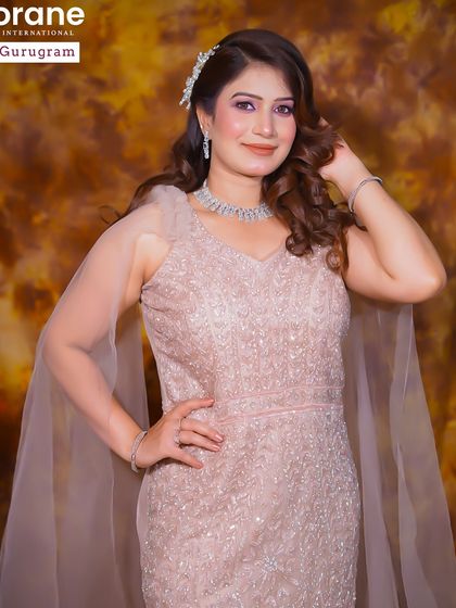 A sophisticated party look in a shimmering pink gown. The makeup is soft yet glamorous, perfect for an evening reception or cocktail event.