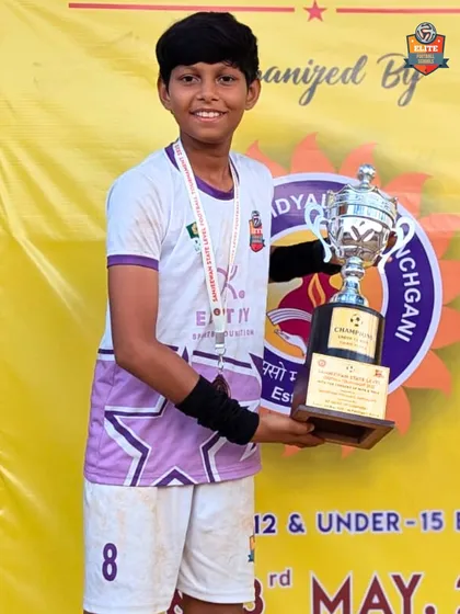 A player proudly holding the 3rd place trophy from the Sanjeewan State Level Tournament.