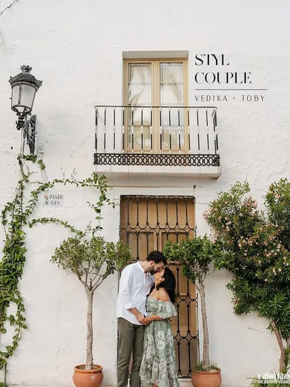 A quiet kiss against a classic Spanish facade. This shot captures the essence of our styling philosophy: creating looks that feel so natural, you can forget about the camera and just be in the moment.