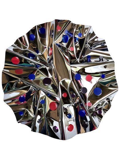 "Meteor 111" is a circular wall sculpture where red and blue dots are scattered across the reflective surface, creating a sense of contained energy.